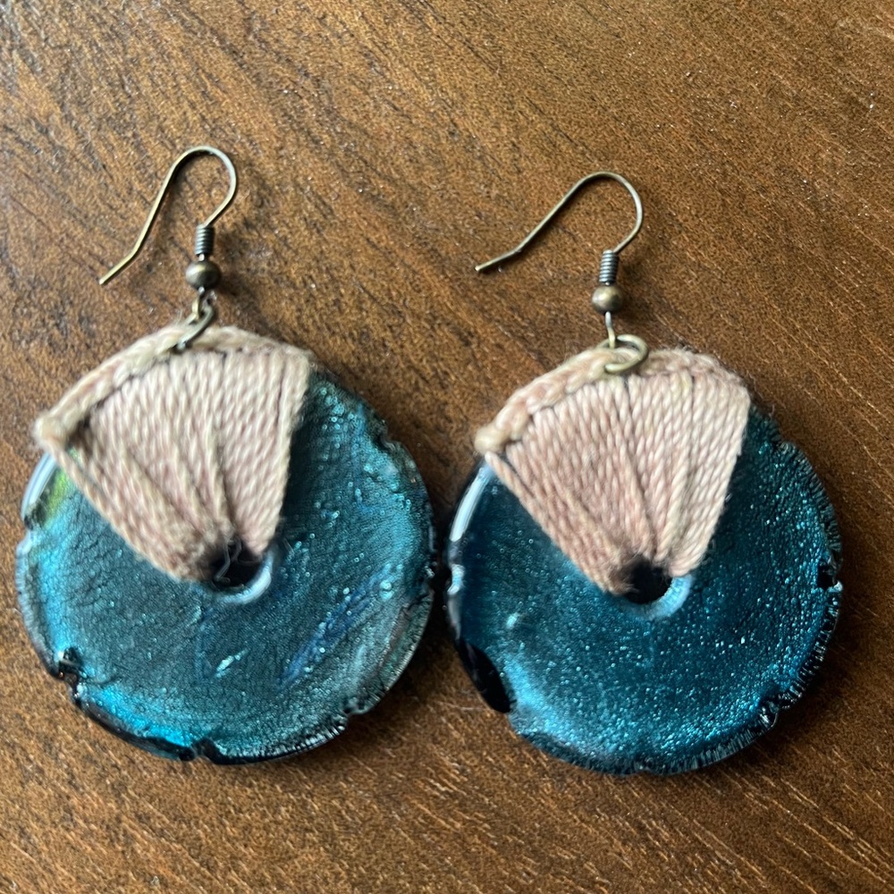 Boho artisanal blue glass and string earrings.